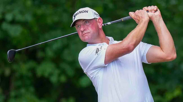 Lucas Glover watches a shot in the final round of the 2023 Wyndham Championship.